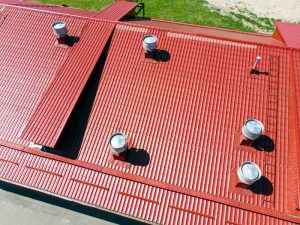 commercial contractors roofing maintenance red metal
